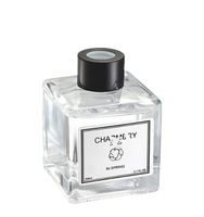 Bouteille de diffusion de roseau d'aromathérapie en verre vide personnalisée avec fleurs en rotin pour améliorer l'air Etiquette de bouteille en verre d'aromathérapie personnalisée