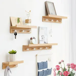 Minimalist bamboo wall shelf with storage hooks used for living room bedroom