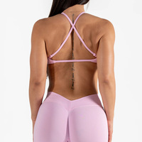 Soutien-gorge de sport simple et respirant sans coutures pour femme, bretelles réglables, dos croisé, coussinets amovibles, maintien moyen, en nylon et élasthanne, idéal pour la gym