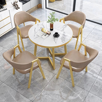 Ensemble de table et de chaises de salle à manger en métal de luxe moderne pour les cafés et les salons de thé