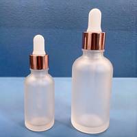 Luxuriöse 1OZ 2OZ 30ml 60ml Runde Ätherische Öl Tropfflaschen Individuelle Farbe Blau Weiß Mattiert und mit Logodruck Glasflaschen