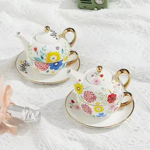 चायदानी और कप कस्टम डिजाइन सिरेमिक सफेद चीनी मिट्टी के बरतन चाय के बर्तन कप सेट चाय के लिए एक चायदानी सेट