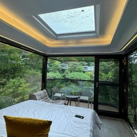 Hôtel modulaire de luxe moderne maison préfabriquée installation facile bateau-maison en verre étanche capsule spatiale de style design chinois