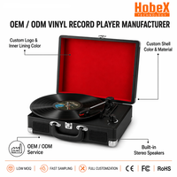 Tourne-disque vintage en forme de valise avec haut-parleurs intégrés pour salon