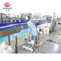 Machine d'impression laser automatique à grande vitesse et stable pour le codage de la date sur les bouteilles PET et les boîtes, pour les cartons en plastique, ligne de production complète
