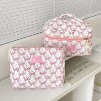 Vente en gros de sacs de maquillage de voyage pochette moelleuse matelassée avec nœud fermeture à glissière stockage portable sac cosmétique cadeau