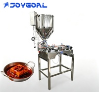 Machine de remplissage pneumatique à double tête avec trémie chauffante et agitateur pour confitures de fruits, sauces chili, granulés et pâtes visqueuses