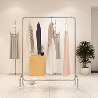 Présentoirs suspendus pour magasin de vêtements ronds en acier inoxydable, haute qualité, prix de gros, 2023