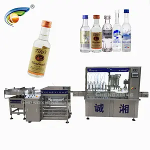 Linea di riempimento automatica personalizzata per bevande alcoliche da 100ml riempitrice per vodka in bottiglia di plastica da 50ml