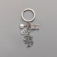 Porte-clés porte-bonheur avec sac d'argent signe dollar et porte-clés arbre d'argent