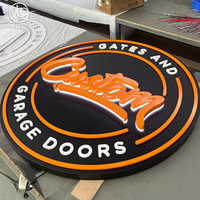Enseigne LED ronde rétroéclairée personnalisée avec accents orange et blancs pour garage ou entreprise