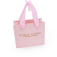 Sacs cadeaux noirs de luxe en papier cartonné avec logo personnalisé en feuille d'or pour la vente en gros