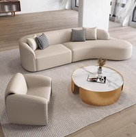 Ensemble de canapés en cuir italien moderne avec design arqué pour hall d'hôtel, comprenant canapé, chaise et table, pour mobilier de réception de salon