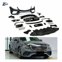 Kit carrosserie style AMG OE 2138850038 compatible avec Classe E W213 2016-2020, matériau PP, ensemble de pare-chocs avant et arrière, calandre, vente en gros