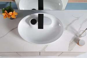 Fregadero de cerámica de lavabo de arte ovalado moderno encimera al por mayor PARA USO HOTELERO diseño novedoso en blanco para hoteles - Product Image 5