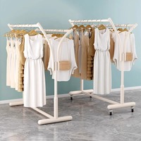 Porte-manteau double simple et mobile pour chambre et balcon, support de vêtements en métal sur pied avec fonction de suspension