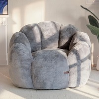 Fauteuil paresseux compact moderne et minimaliste en tissu, rempli de mousse, idéal pour les petits appartements et chambres à coucher