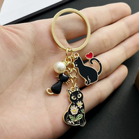 Porte-clés chat noir émaillé style dessin animé avec perle et cœur, pendentif de sac en métal – Grande Vente