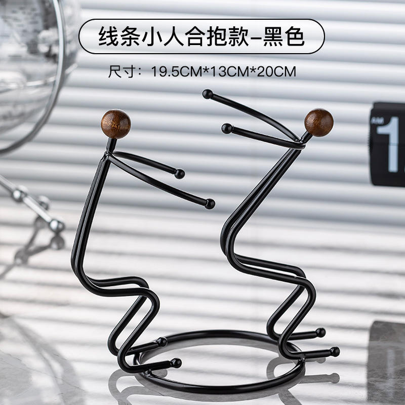 Figuras en miniatura abrazándose - Negro