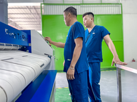 Calandre à repasser automatique professionnelle pour blanchisserie industrielle