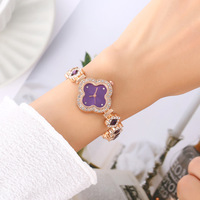 Nouvelle montre-bracelet décontractée pour femme, style trèfle à quatre feuilles, gravée de diamants, cadeau de luxe pour femme