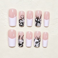 Bestseller transfrontalier : Autocollants pour ongles personnalisables, style français minimaliste blanc, motifs tête de mort et visage de fantôme d'Halloween, faux ongles.