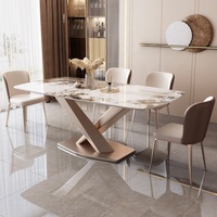 Table à manger moderne en pierre frittée avec base dorée en X et ensemble de chaises en cuir pour hôtel et maison