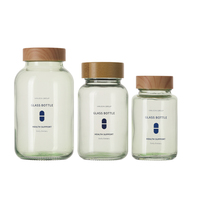 Bouteille en verre personnalisée pour gommes et médicaments en forme de capsule ronde, avec bouchon à vis et couvercle en bois, contenances 30/60/80/100/120/150/200 ml