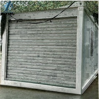 Maison conteneur mobile moderne de 20 pieds avec volet roulant, porte portable préfabriquée, boîte de garage en acier pour salle de bain