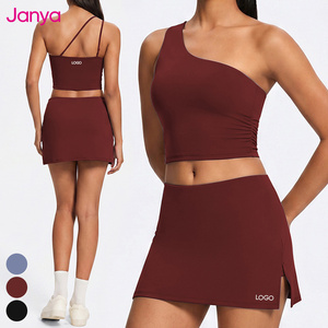 Ensemble de tennis 2 pièces Janya Fashion : Haut asymétrique et jupe taille haute, mini-jupe-short extensible et ajustée pour le yoga, le sport et le golf, vêtements de sport pour femme - Product Image 1