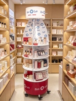 Présentoir de vente au détail rotatif à 360° personnalisé avec boîte lumineuse et roulettes, présentoir multi-niveaux pour snacks, cosmétiques et produits pharmaceutiques