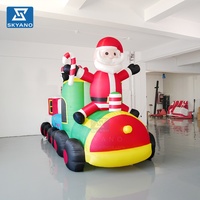 Grandes décorations de Noël gonflables : Père Noël et train pour affichage publicitaire de festival