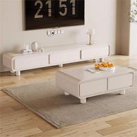 Ensemble de meubles TV minimalistes style Japandi, finition crème chaud, coins arrondis, avec table basse assortie, pour salon.
