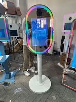 Miroir Magique Tactile Ovale 21,5 pouces à Vendre : Machine Distributrice pour Appareils Photo 2000D, iPad et Smartphones – Idéal Mariages et Événements