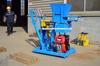 Machine manuelle à briques de terre compressée Hr2-25 pour briques emboîtables en argile rouge