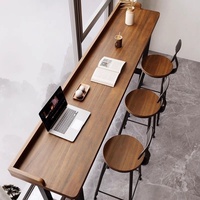 Table haute en bois massif pour salons de thé et balcons, style nordique, avec chaises mobiles intégrées pour séparation de fenêtre