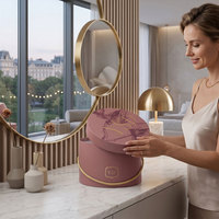 Boîte cadeau ronde de luxe personnalisée avec poignée en corde pour l'emballage de fleurs, les cosmétiques et la présentation de marques de boutiques