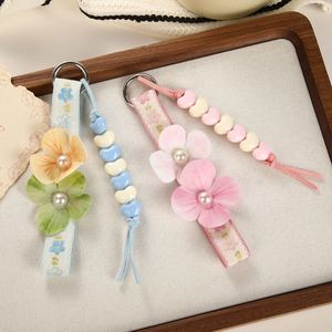 Porte-clés en plastique PU style coréen trèfle à quatre feuilles avec impression UV, breloque de sac à pompon floral, pendentif cordon de poignet pastel d'été - Product Image 2