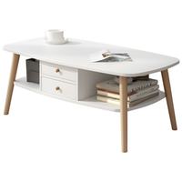 Table basse ovale double couche peu encombrante avec tiroir fermé et étagère ouverte, taille compacte pour salon familial de petite taille