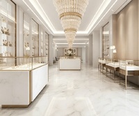 Îlot de présentation de bijoux haut de gamme en marbre blanc et or, vitrine en verre premium pour les boutiques de bijoux de luxe
