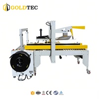 Système d'emballage robuste Goldtec : Scelleuse automatique de caisses pliantes et cerclage pour machines d'emballage de boîtes