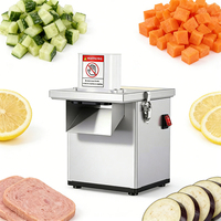 Veelzijdige commerciële gemotoriseerde 220V snij-, schaaf- en blokjesmachine voor restaurantgebruik, geschikt voor groenten, fruit en aardappelen in delicatessenkeukens.