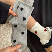 Chaussettes décontractées mi-mollet confortables pour femmes, style automne ; tons noir, blanc, gris, design polyvalent et simple, antidérapantes, en polyester