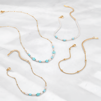 Ensemble de bijoux bohème en acier inoxydable plaqué or 18 carats avec des liens en forme de fleurs, imitation perle turquoise, collier et bracelet pour femmes