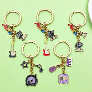 Nuevo Llavero de Moda 2025 con Colgante de Notas Musicales de Guitarra y Piano, Accesorio para Llaves de Bolsa - Product Image 1