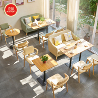 Ensemble de table et chaises de restaurant avec banquette, plateau en marbre, structure en métal robuste, sièges en cuir résistant aux taches - Usage commercial