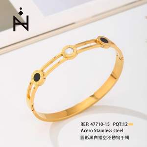 Brazalete redondo de acero inoxidable hueco en blanco y negro para mujer, brazalete minimalista chapado en oro para uso diario - Product Image 1