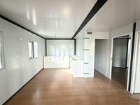 Maison conteneur extensible polyvalente de 20 pieds, finition bois, pour habitation en milieu forestier