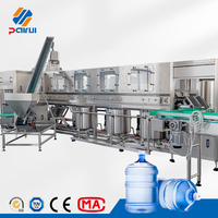Machine de remplissage de barils d'eau de 5 gallons, 600 barils par heure, ligne de lavage, remplissage et bouchage entièrement automatique, vente directe usine pour usine d'eau pure