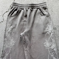 Ensemble de survêtement streetwear automne personnalisé, comprenant un sweat à capuche zippé intégral et un pantalon large, avec imprimé grimpes et accents en strass, coupe oversize, 2 pièces